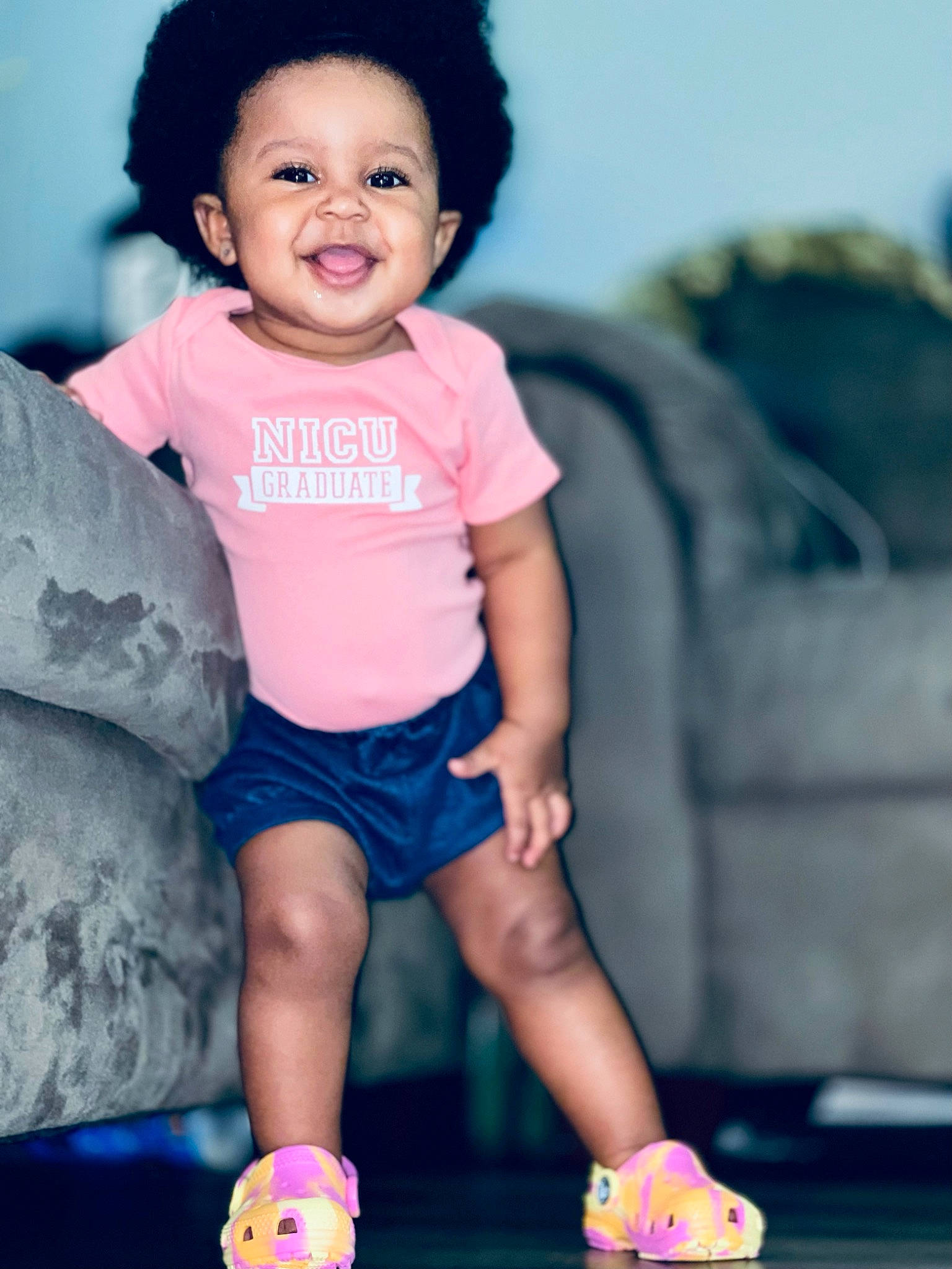 Adira is registered to the contest to win money with this photo: baby_toddler_clothing, blue, eye, face, facial_expression, fashion, flash_photography, gesture, hairstyle, happy, head, human, joy, person, photograph, pink, product, shorts, skin, sleeve