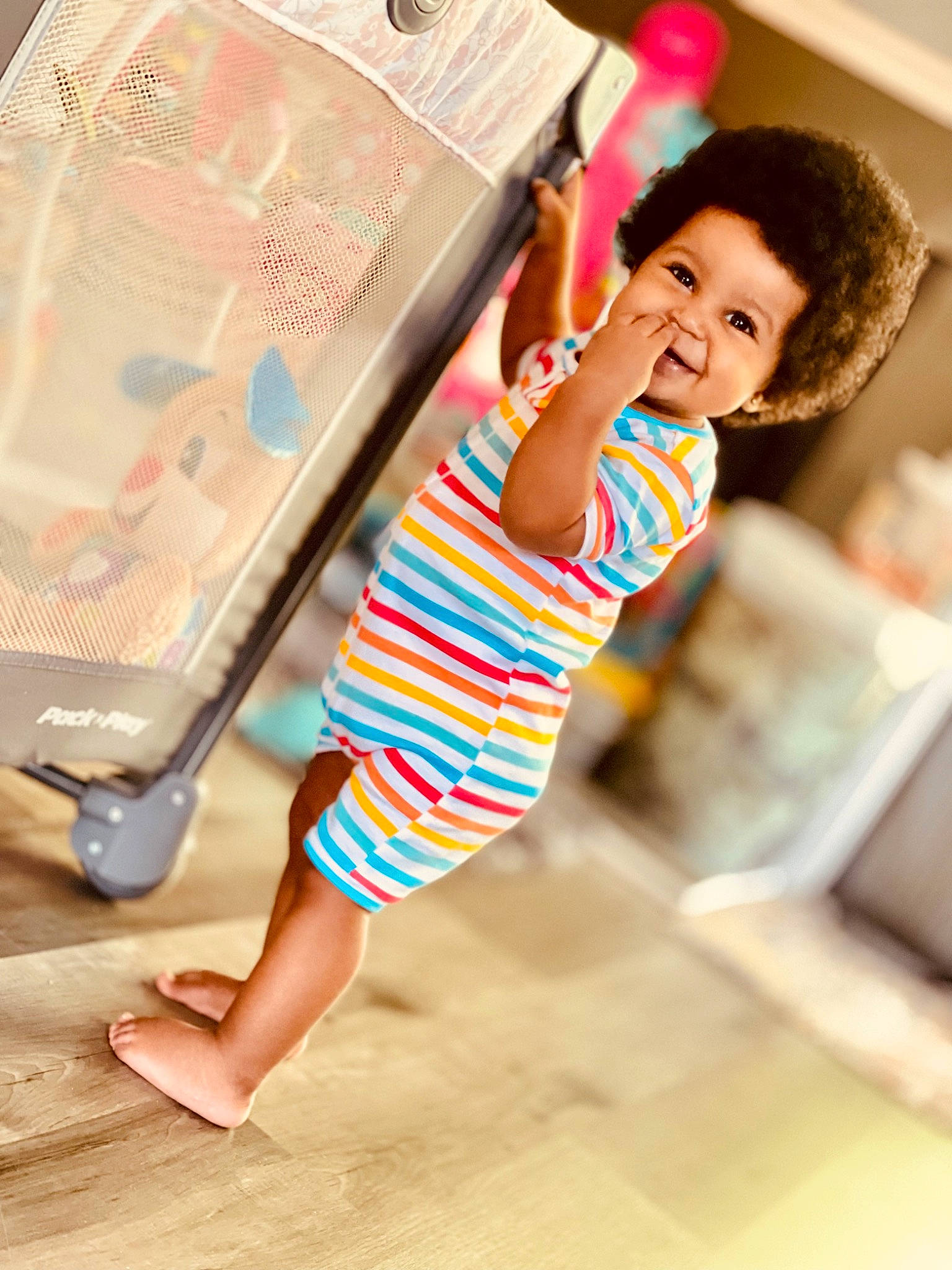 Adira is registered to the contest to win money with this photo: baby, baby_toddler_clothing, dress, elbow, fashion_design, foot, fun, happy, human_leg, joy, leg, leisure, linens, neck, person, room, skin, sleeve, t_shirt, thigh
