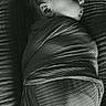 Naomi is registered to the contest to win money with this photo: baby, newborn, sleeping, swaddled, blanket, texture, black_and_white, portrait, peaceful, infant, side_profile, close_up, soft_light, calm, resting, fabric, wrapped, cute, child, indoors