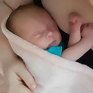 Naomi joined the competition — help win amazing prizes! newborn, baby, blanket, sleeping, hand, arm, skin, infant, closeup, soft, comfort, rest, tenderness, person, parent, cradle, wrapped, peaceful, indoor, family