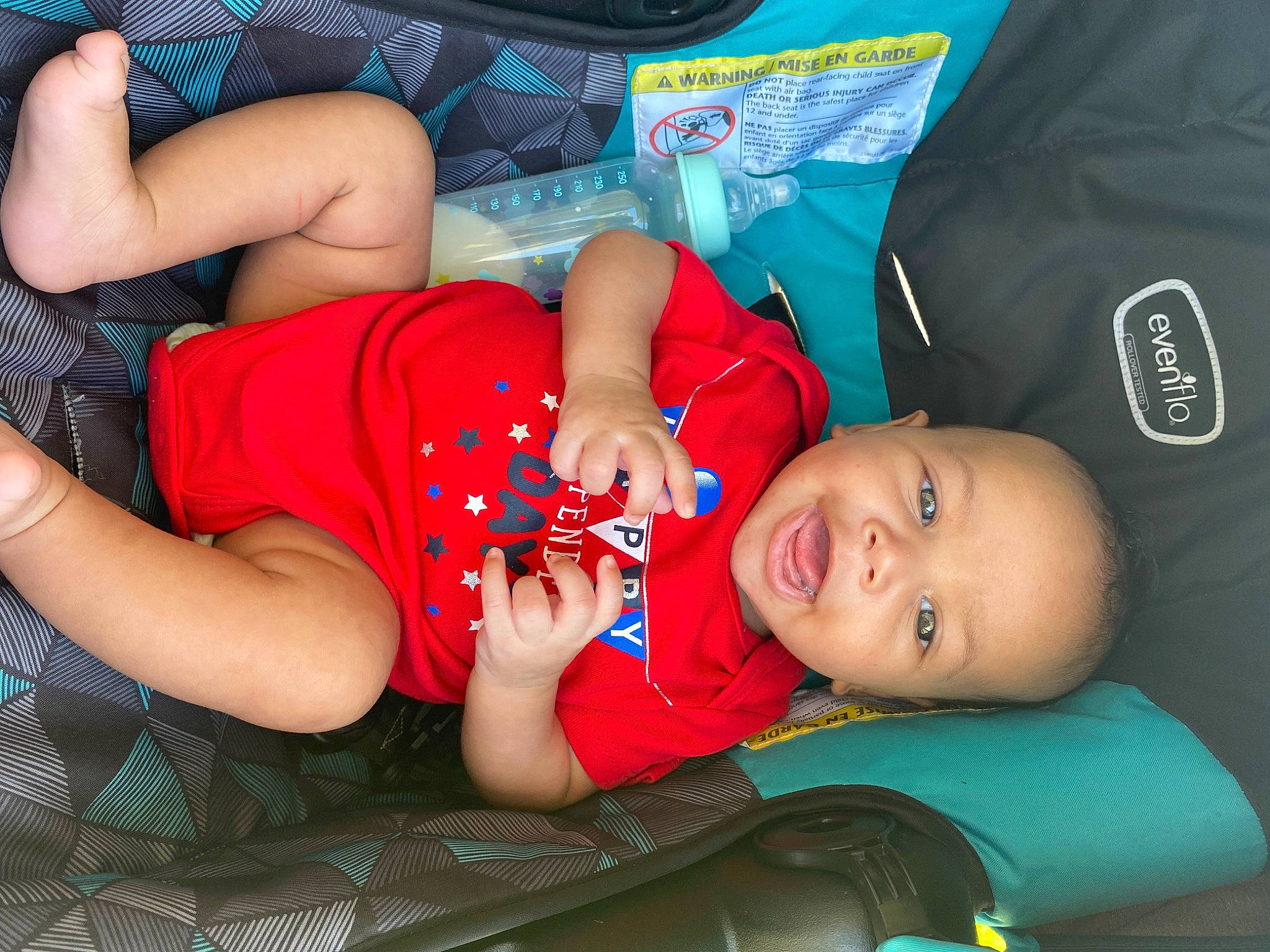 Supreme is registered to the contest to win money with this photo: arm, baby_toddler_clothing, blue, child, comfort, elbow, electric_blue, fun, hat, human_leg, joint, leg, leisure, mouth, person, plant, red, sitting, smile, thigh