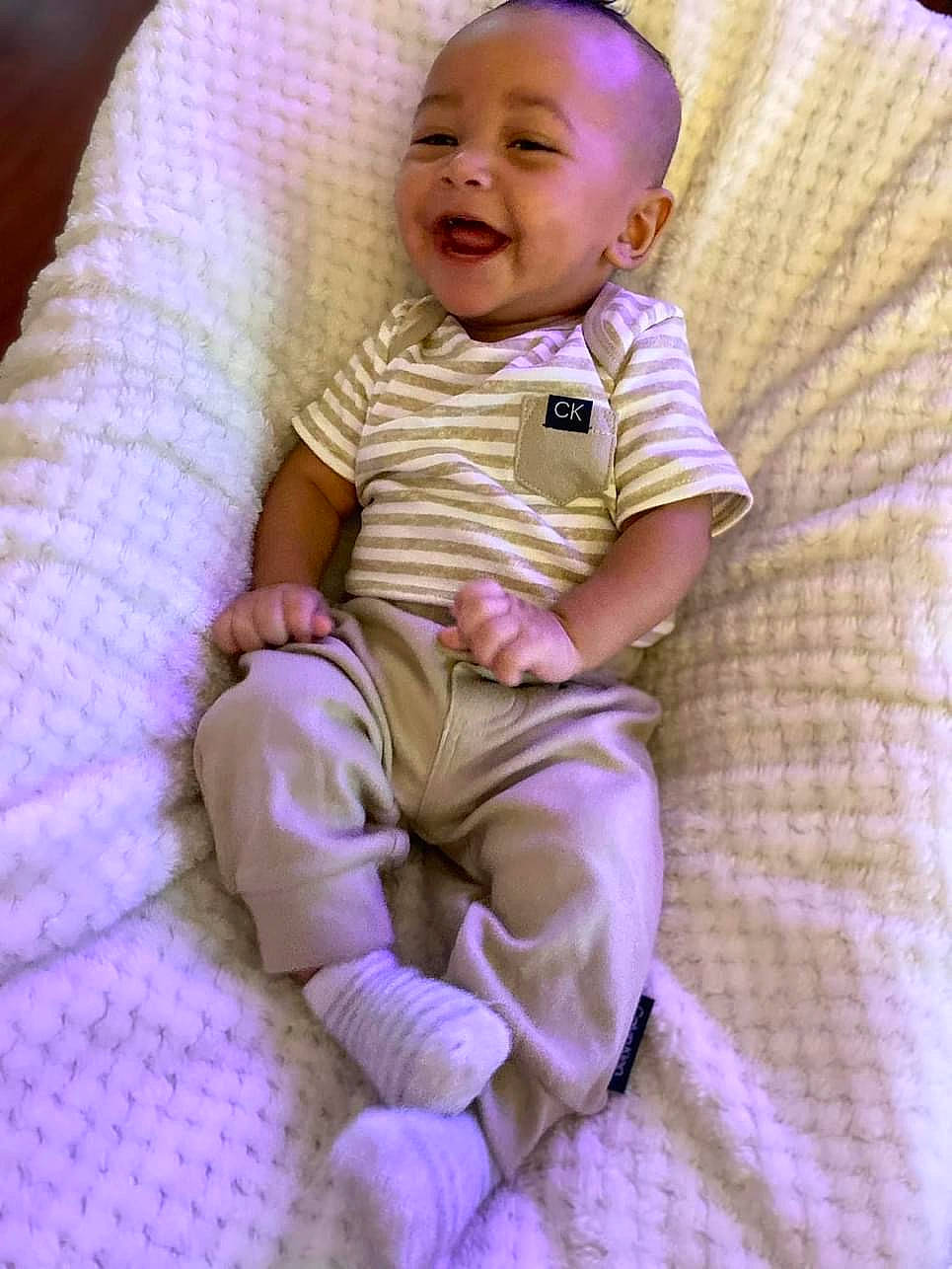 Supreme joined the competition — help win amazing prizes! baby, baby_products, baby_toddler_clothing, cheek, child, comfort, eye, happy, iris, linens, lip, magenta, person, pink, purple, sitting, skin, sleeve, smile, t_shirt