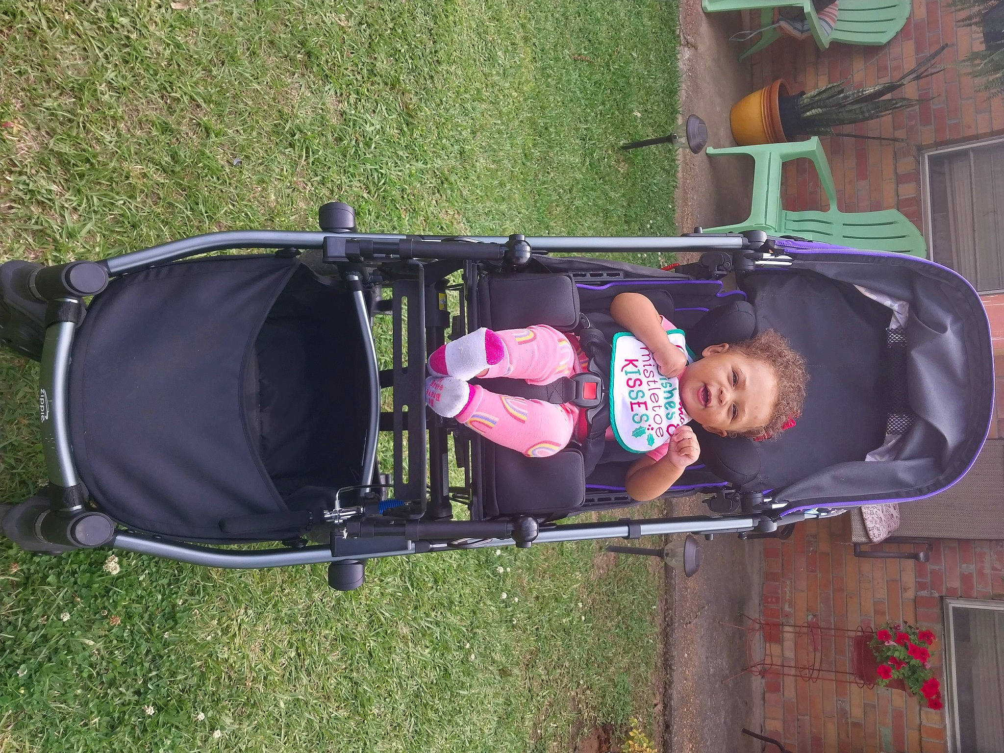 Celina joined the competition — help win amazing prizes! auto_part, baby, baby_products, baby_toddler_clothing, child, fun, grass, person, plant, smile, tire, toddler, vehicle, wheel