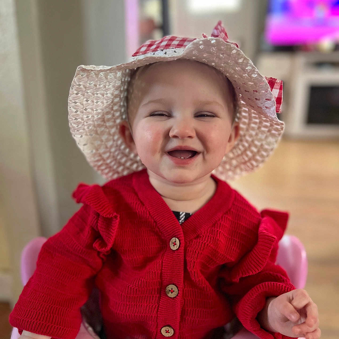 Hadley joined the competition — help win amazing prizes! baby, bonnet, clothing, coat, computerhardware, electronics, face, happy, hardware, hat, head, jacket, knitwear, monitor, person, photography, portrait, screen, smile, sweater