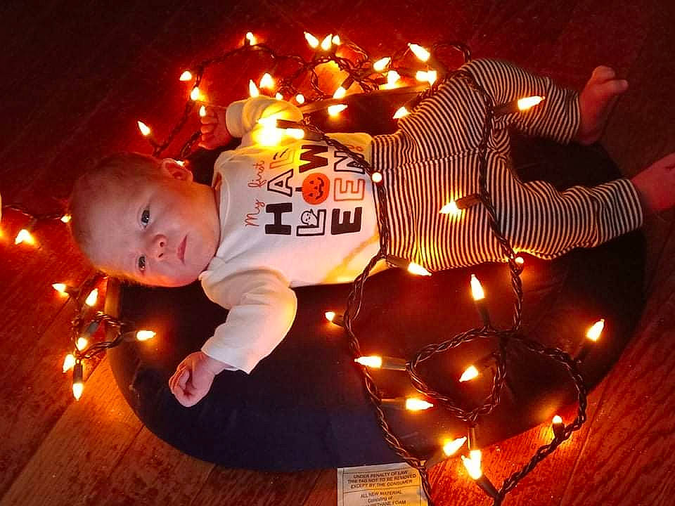 Chloe Scott joined the competition — help win amazing prizes! beauty, christmas, christmas_decoration, christmas_eve, christmas_lights, darkness, design, event, flame, flash_photography, fun, happy, heat, holiday, lighting, night, orange, party_supply, person, toddler