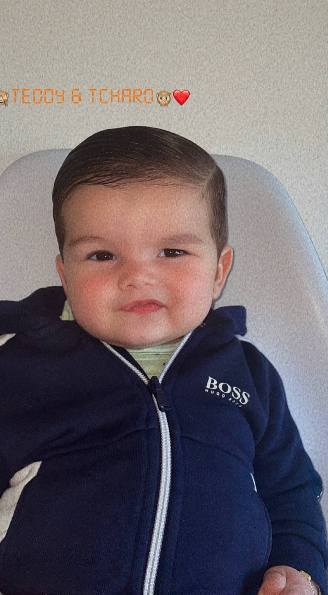 Teddy participe au concours pour gagner de l'argent avec cette photo : cheek, child, collar, comfort, eye, eyelash, happy, hood, iris, jacket, jaw, neck, nose, outerwear, person, selfie, sleeve, smile, t_shirt, toddler