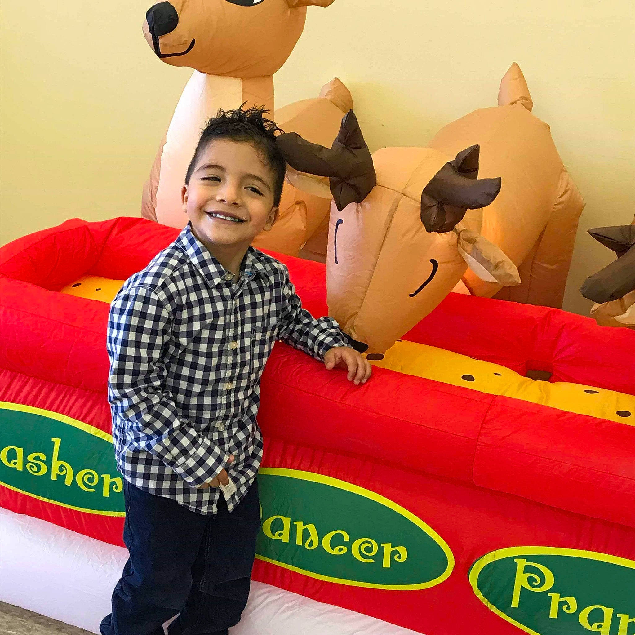 Jerome is registered to the contest to win money with this photo: child, fun, games, inflatable, joy, person, play, plush, product, recreation, smile, stuffed_toy, textile, toddler, toy