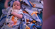 Legynd joined the competition — help win amazing prizes! baby, infant, child, portrait, lying_down, blanket, baby_blanket, cartoon, animal_pattern, bed, cozy, indoors, home, face, eyes, nose, white_clothing, pink, soft_lighting, photograph