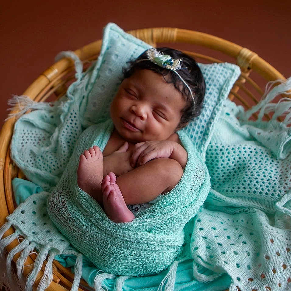 Gianna joined the competition — help win amazing prizes! baby, basket, bed, blanket, clothing, crib, cushion, face, furniture, hat, head, homedecor, infantbed, newborn, person, photography, portrait, quilt, sleeping, towel