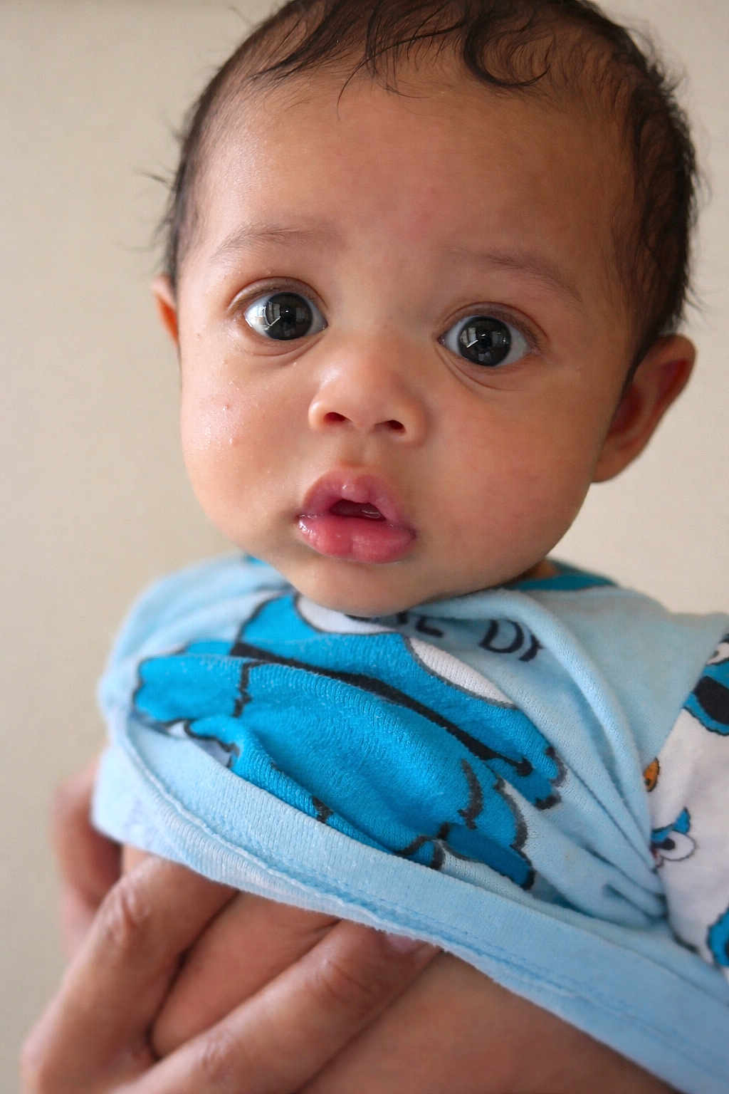 Uzi joined the competition — help win amazing prizes! baby, child, face, eyes, blue_clothing, hand, infant, portrait, cute, looking, expression, skin, person, young, closeup, head, indoors, holding, apparel, background
