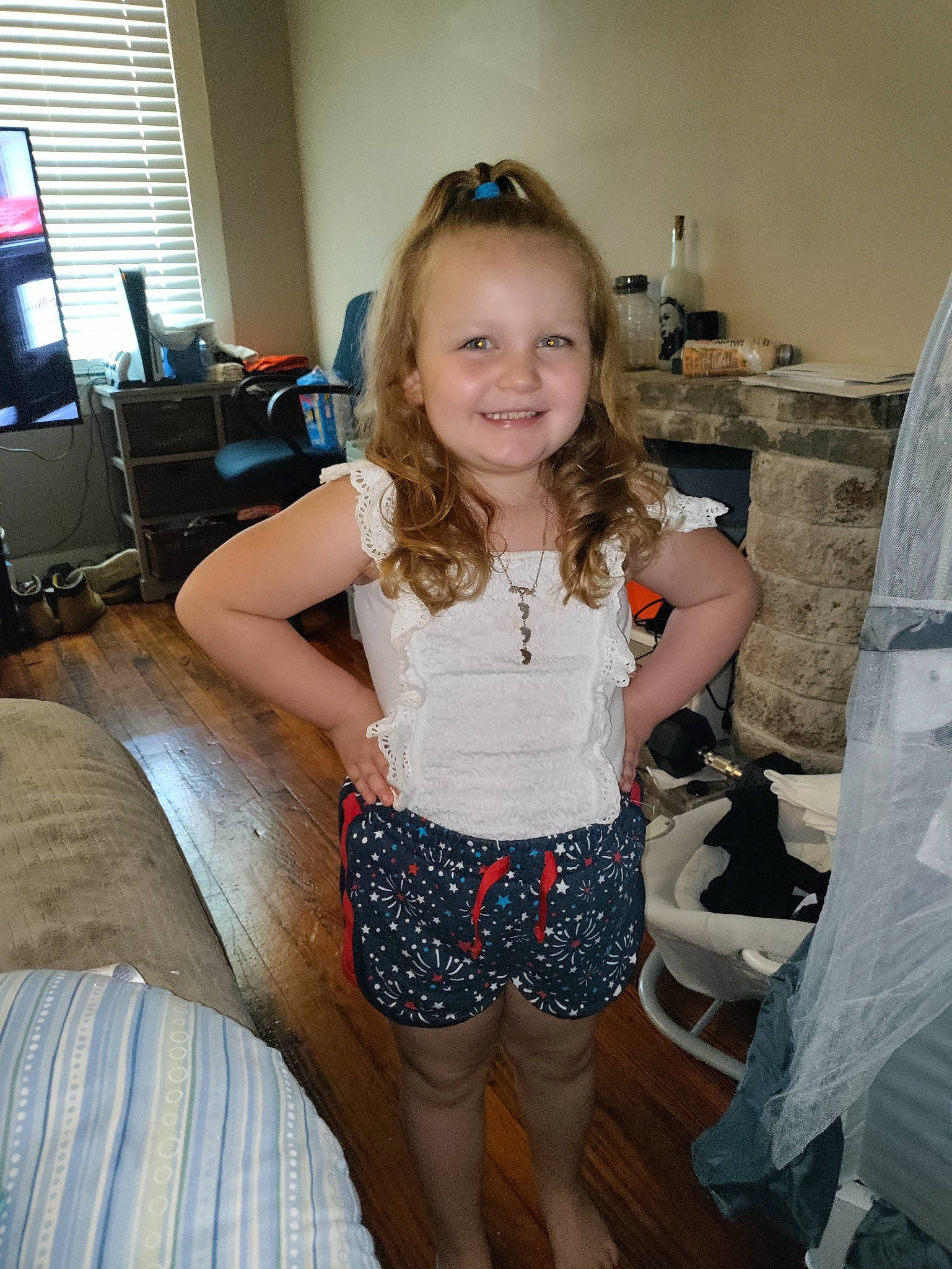 Skylynn is registered to the contest to win money with this photo: abdomen, blond, computer_monitor, couch, fashion_design, fun, happy, human_leg, joint, joy, knee, leg, long_hair, person, shorts, shoulder, smile, sunglasses, television, thigh