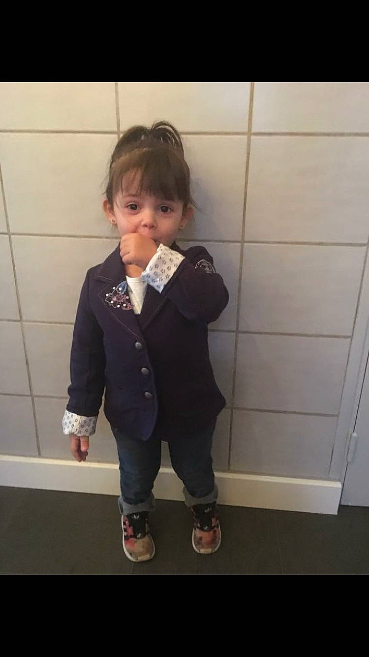 Kenza participe au concours pour gagner de l'argent avec cette photo : blazer, bow_tie, child, formal_wear, jacket, outerwear, person, school_uniform, snapshot, square, standing, suit, tie, toddler, tuxedo, uniform