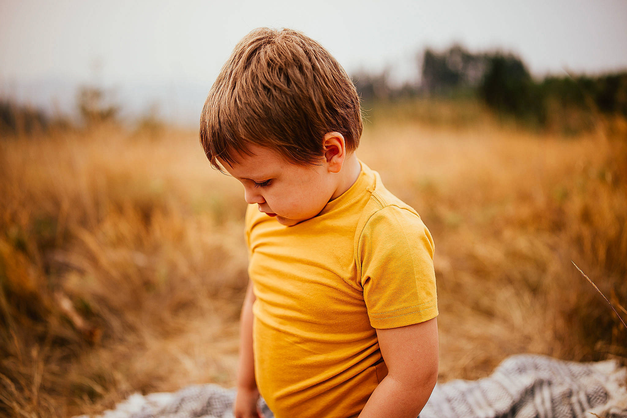 Jayden joined the competition — help win amazing prizes! blond, brown_hair, child, field, flash_photography, fun, grass, grassland, hairstyle, happy, horizon, landscape, leisure, meadow, people_in_nature, person, prairie, sitting, sky, t_shirt