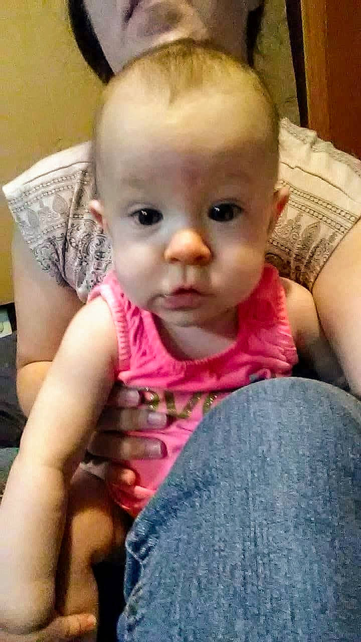 Aurora is registered to the contest to win money with this photo: baby, baby_toddler_clothing, cheek, chest, child, comfort, ear, eyebrow, eyelash, finger, fun, iris, lip, mouth, nose, person, sitting, skin, sleeve, thumb