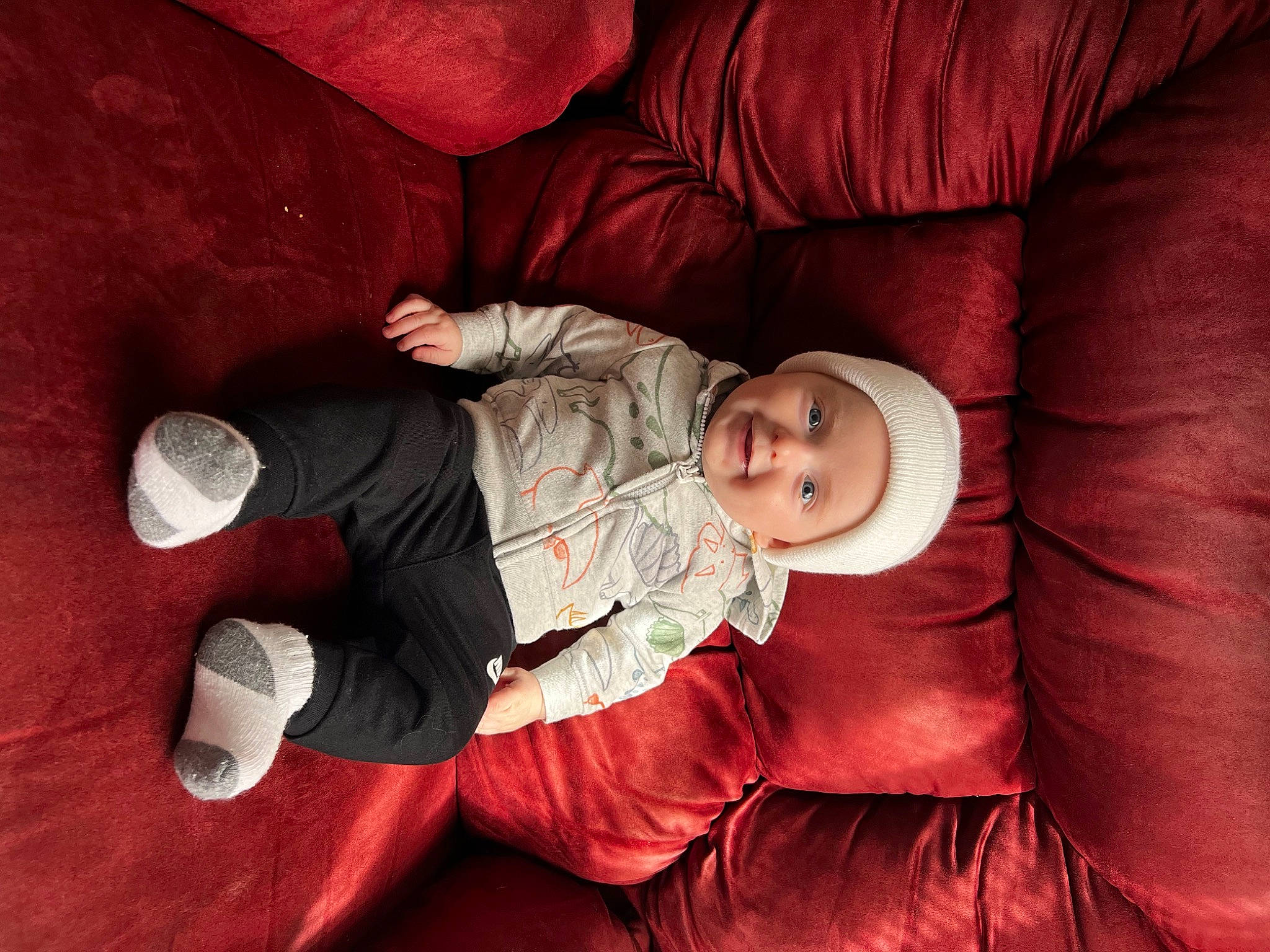 Cannon joined the competition — help win amazing prizes! baby, baby_toddler_clothing, carmine, child, comfort, couch, finger, flash_photography, flooring, fun, headwear, lap, linens, magenta, person, red, room, sitting, textile, toddler