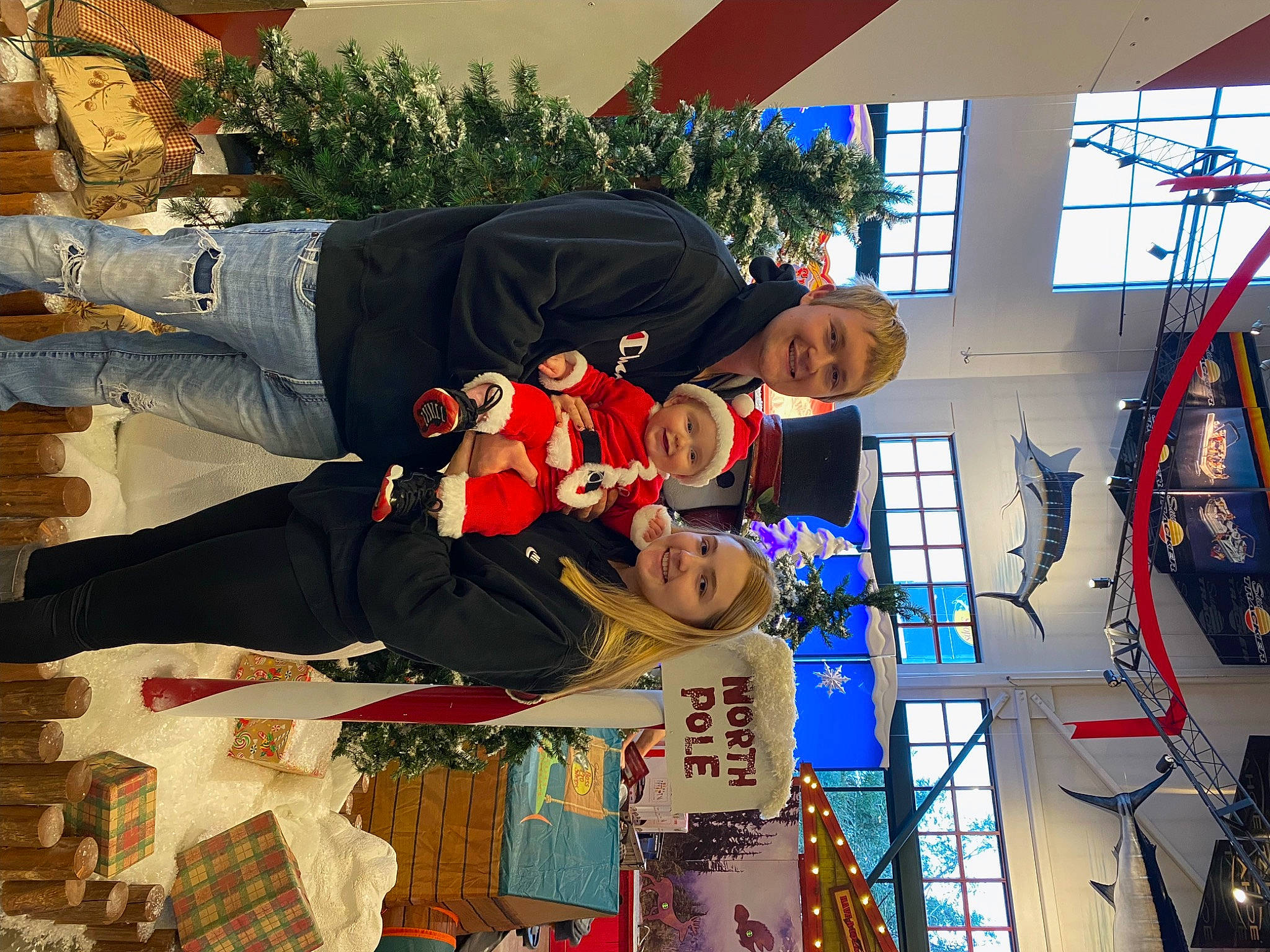 Cannon is registered to the contest to win money with this photo: child, christmas, event, fun, happy, headwear, holiday, interior_design, joy, leisure, people, person, plant, room, smile, tradition, tree, world