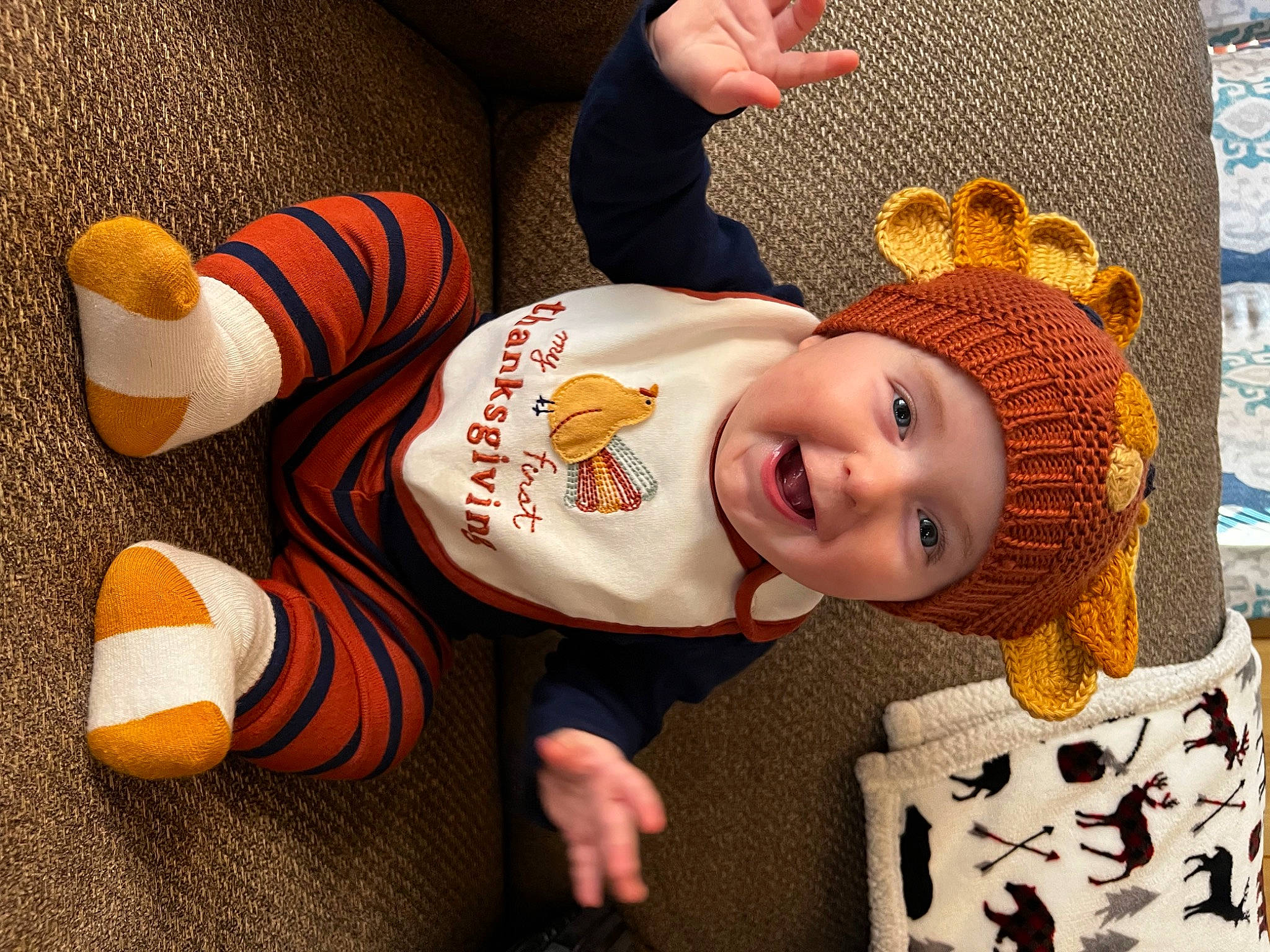 Cannon joined the competition — help win amazing prizes! baby, baby_toddler_clothing, carmine, child, flooring, foot, happy, hat, headwear, human_leg, knee, orange, pattern, person, sleeve, smile, sock, sportswear, thigh, toddler