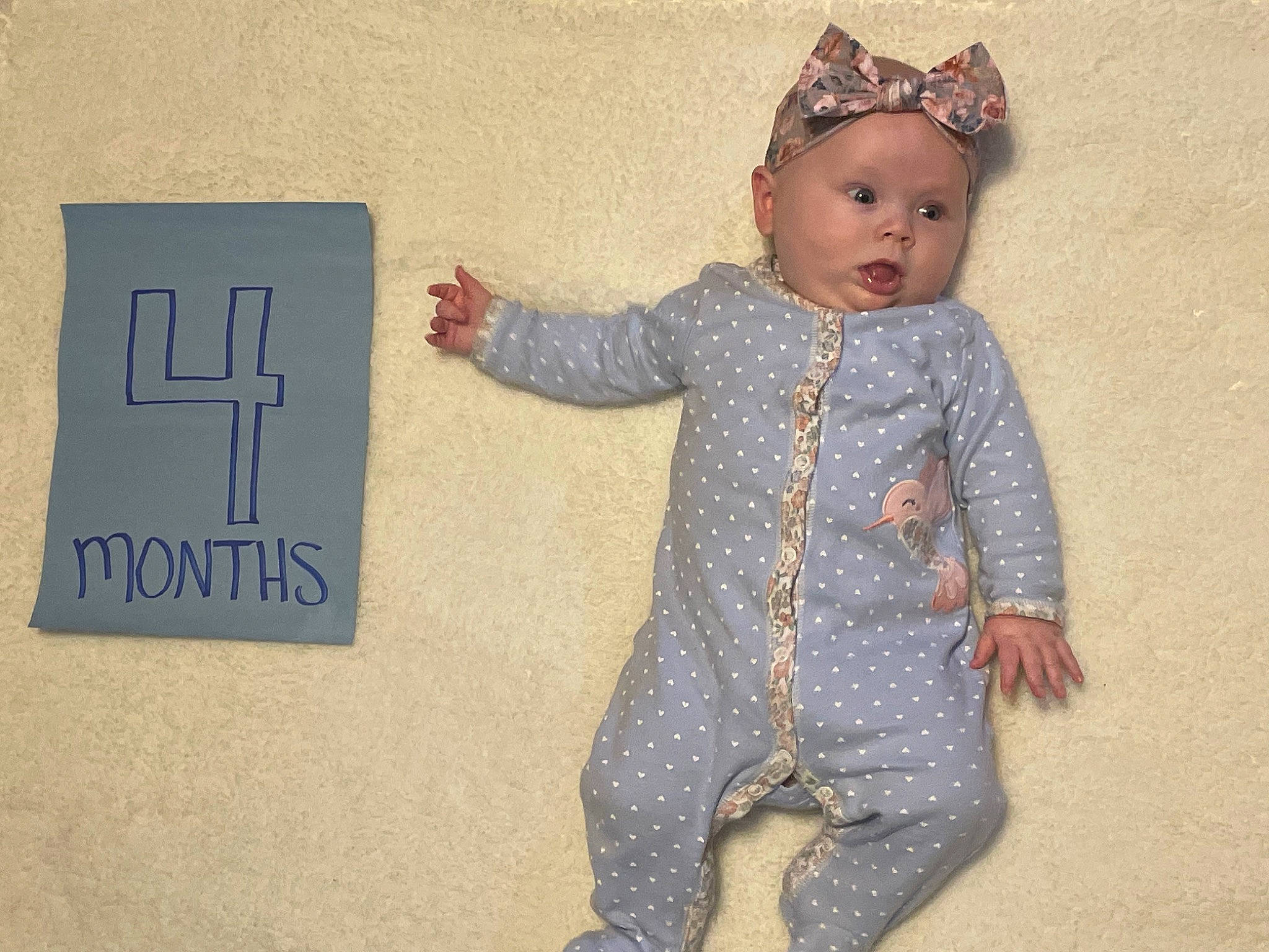 Onyx is registered to the contest to win money with this photo: baby, baby_toddler_clothing, child, costume_hat, fashion_accessory, finger, font, fun, gesture, happy, headband, headwear, jewellery, number, pattern, person, room, sleeve, standing, thumb