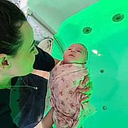 Julian participe au concours pour gagner de l'argent avec cette photo : adult, baby, bath, bathtub, blanket, care, comfort, green_light, holding, indoor, infant, love, portrait, relaxation, skin, swaddled, tattoo, tender, water, woman