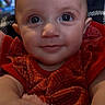 Kyrsten joined the competition — help win amazing prizes! arm, baby, child, close_up, cute, eyes, face, hand, happy, indoor, infant, patterned_clothing, person, portrait, red_clothing, skin, smile, soft_texture, warm_lighting, young_child