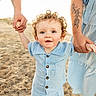 Colton joined the competition — help win amazing prizes! toddler, child, beach, sand, family, holding_hands, curly_hair, blue_clothing, sunlight, outdoor, parent, tattoo, happy, walking, summer, casual_wear, portrait, cute, vacation, nature