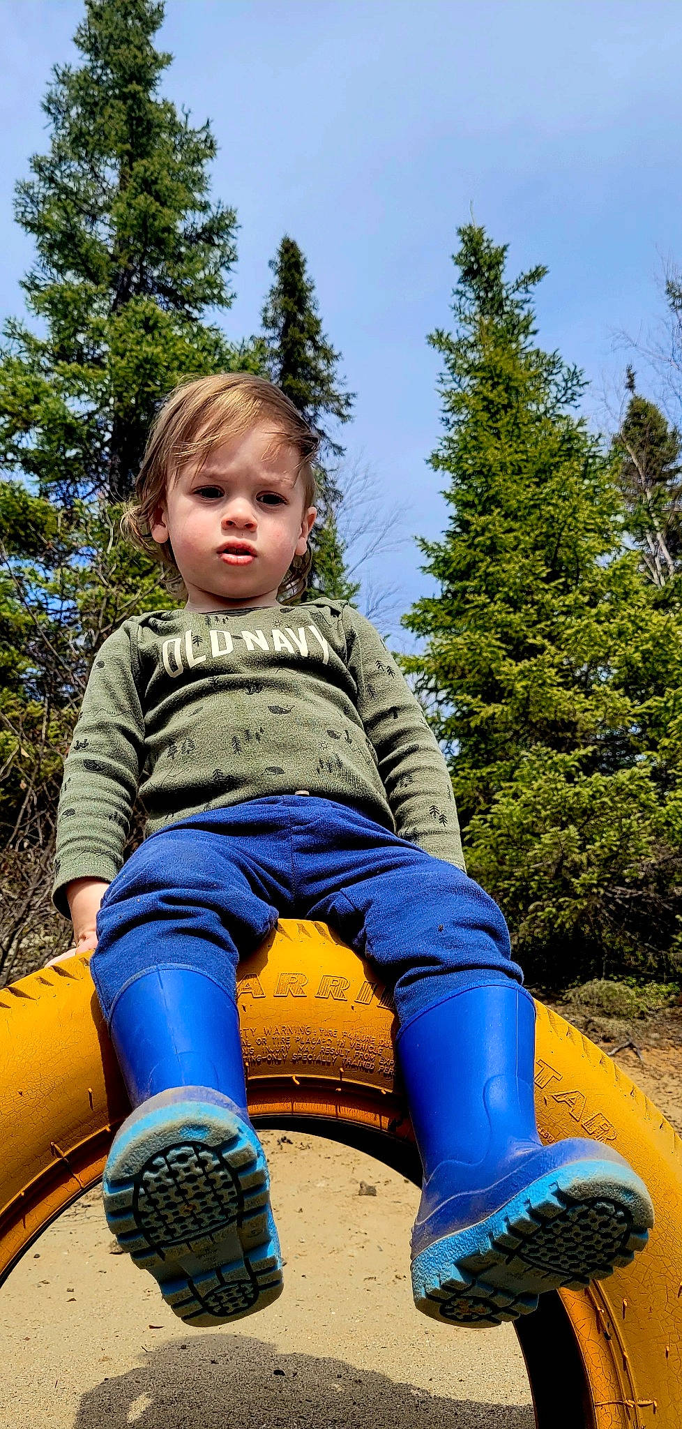 Denver joined the competition — help win amazing prizes! arm, automotive_tire, blue, child, fun, grass, happy, human_body, leisure, nature, outdoor_play_equipment, people_in_nature, person, plant, recreation, sky, t_shirt, toddler, tree, vertebrate