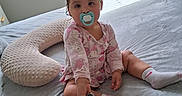 Kylie joined the competition — help win amazing prizes! baby, bed, blanket, blinds, child, curious, cute, furniture, indoor, light, onesie, pacifier, person, playful, red_bow, shadow, smartphone, socks, toddler, window