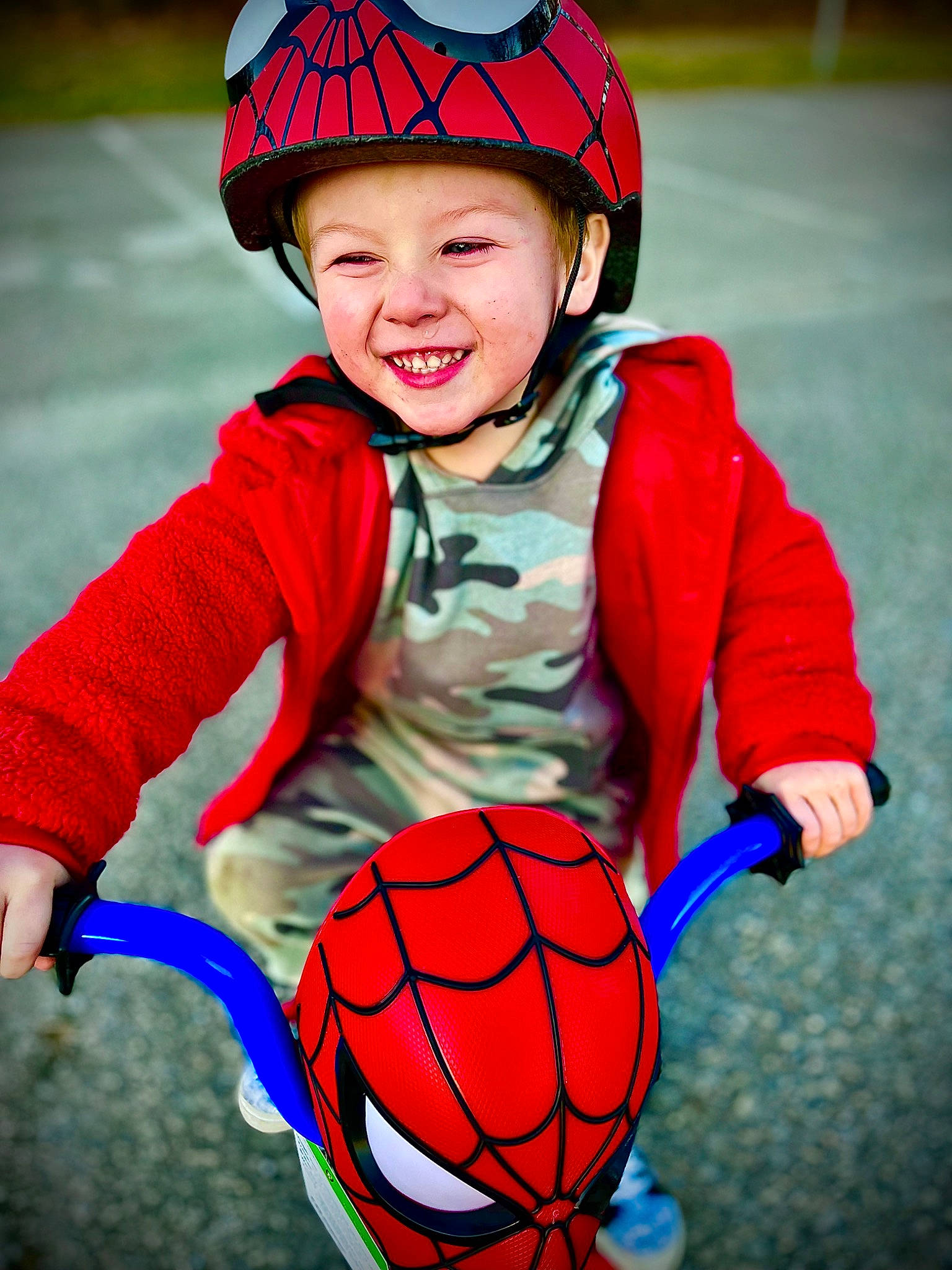 Jayce is registered to the contest to win money with this photo: arm, ball, bicycle_helmet, clothing, eye, face, facial_expression, football, happy, head, headwear, human, human_body, joy, orange, organ, person, photograph, playing_sports, smile