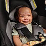 Jayceon is registered to the contest to win money with this photo: baby, car_seat, child, smile, infant, seatbelt, safety, cute, happy, person, clothing, striped_shirt, indoor, head, hand, seat, car_interior, baby_toddler, closeup, portrait