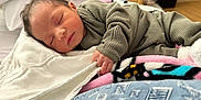 Jayceon joined the competition — help win amazing prizes! baby, newborn, sleeping, blanket, bed, clothing, infant, hand, face, cozy, soft, indoors, cute, peaceful, rest, portrait, child, warm, comfort, toddler