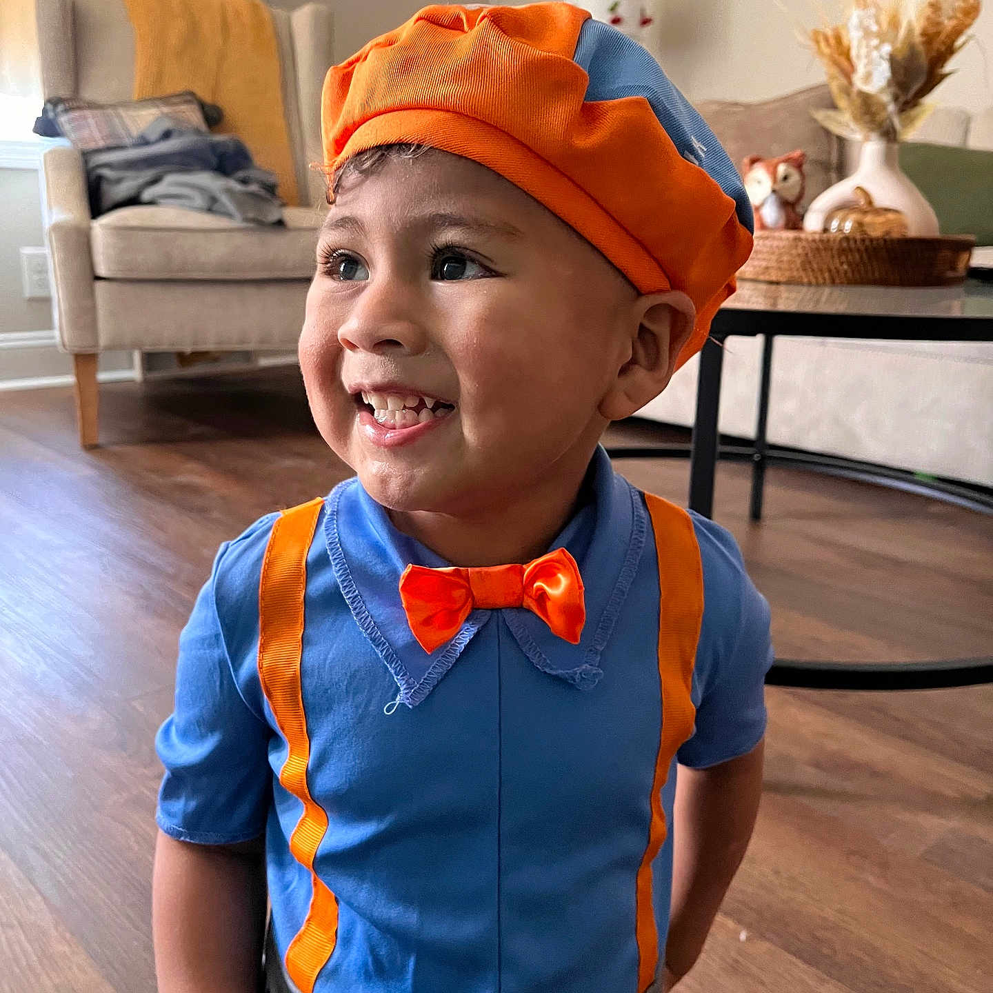 Zahir is registered to the contest to win money with this photo: accessories, architecture, building, clothing, couch, face, formalwear, furniture, happy, hat, head, indoors, livingroom, person, photography, portrait, room, smile, tie, wood