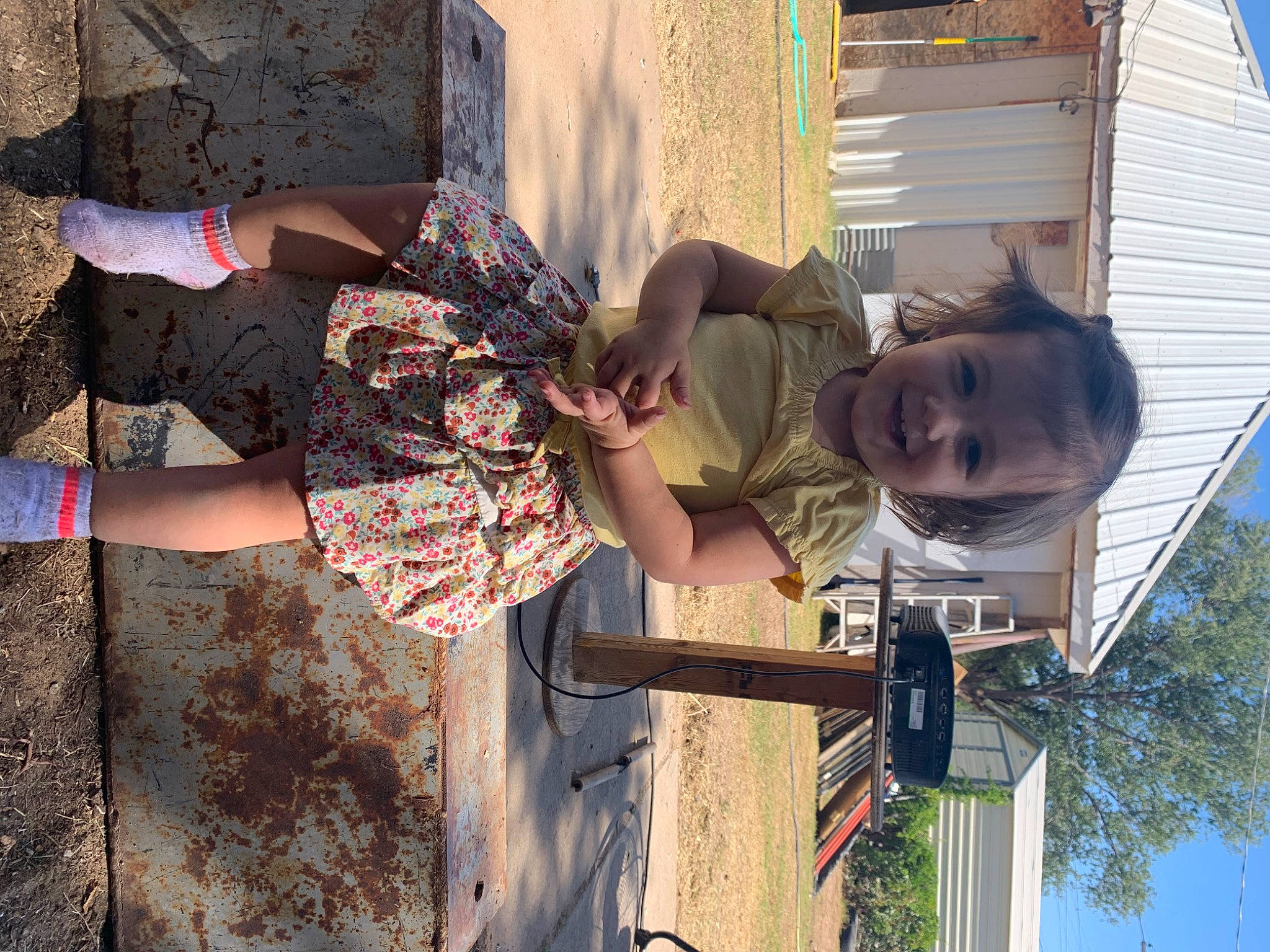 Avri is registered to the contest to win money with this photo: daytime, eyewear, fun, happy, human_leg, joy, leisure, pattern, person, plant, sandal, shadow, sky, smile, summer, thigh, toddler, tree, vacation, visual_arts