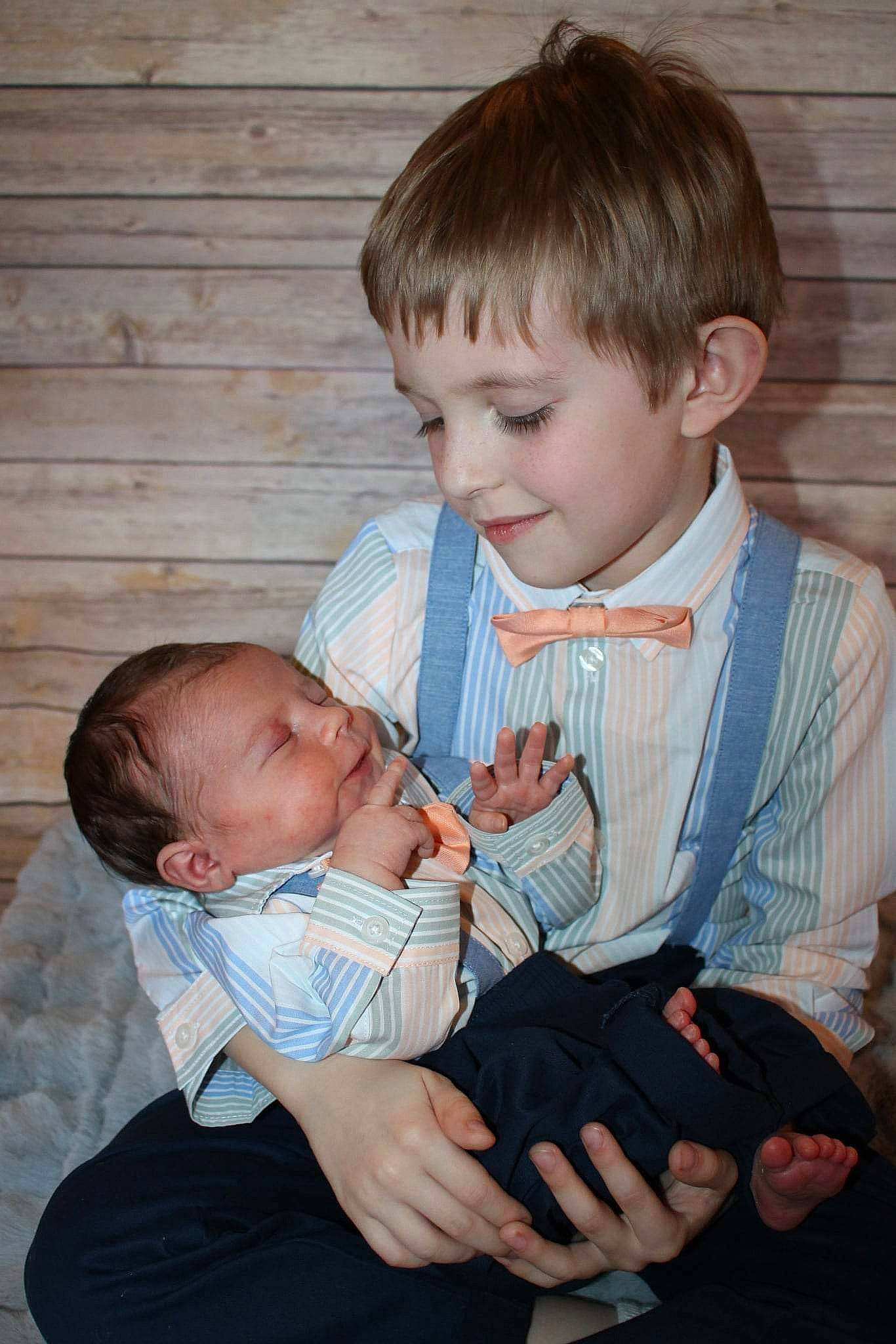 Caleb is registered to the contest to win money with this photo: baby, baby_toddler_clothing, beauty, cheek, chin, eye, facial_expression, finger, gesture, hair, hairstyle, hand, happy, iris, lap, person, product, skin, standing, thumb