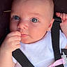 Summer is registered to the contest to win money with this photo: baby, infant, child, face, blue_eyes, hand, onesie, harness, straps, pacifier, pink_clip, skin, expression, closeup, portrait, cute, young, person, seated, indoor
