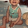 toddler, child, smiling, sitting, play_mat, pacifier, beads, striped_shirt, indoor, toy, floor, happy, cute, baby, playtime, person, face, hands, feet, home