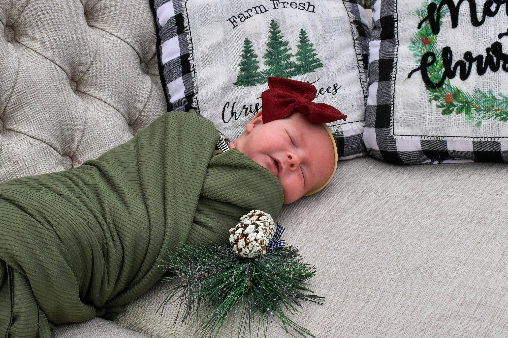Magnolia is registered to the contest to win money with this photo: baby, bedding, child, comfort, couch, flooring, grass, green, grey, linens, nap, pattern, person, plaid, room, sitting, sleeve, textile, toddler, white