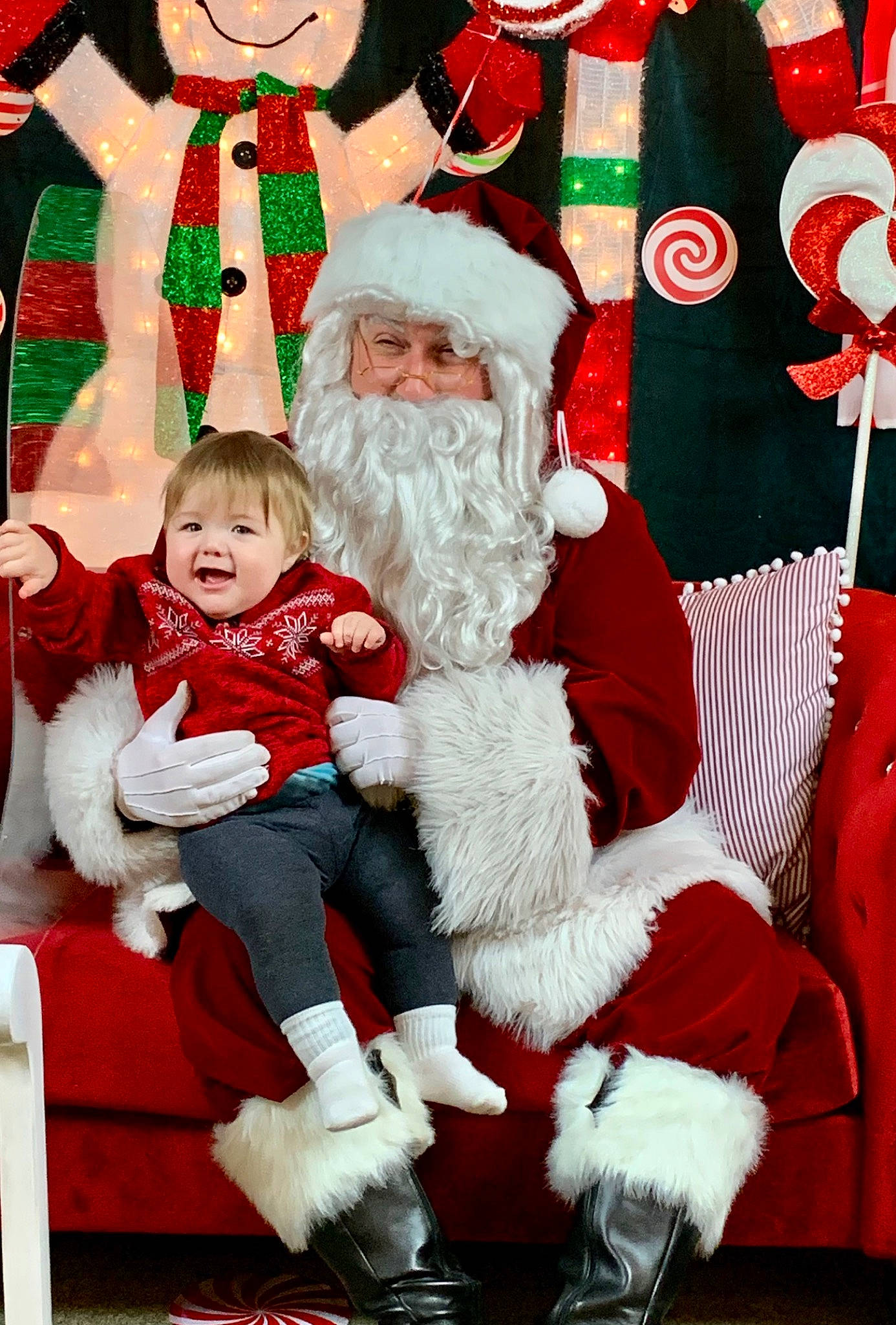 Griffin joined the competition — help win amazing prizes! christmas, christmas_decoration, christmas_eve, event, face, fictional_character, green, happy, head, headwear, holiday, human_body, lap, people, person, photograph, red, santa_claus, smile, snapshot