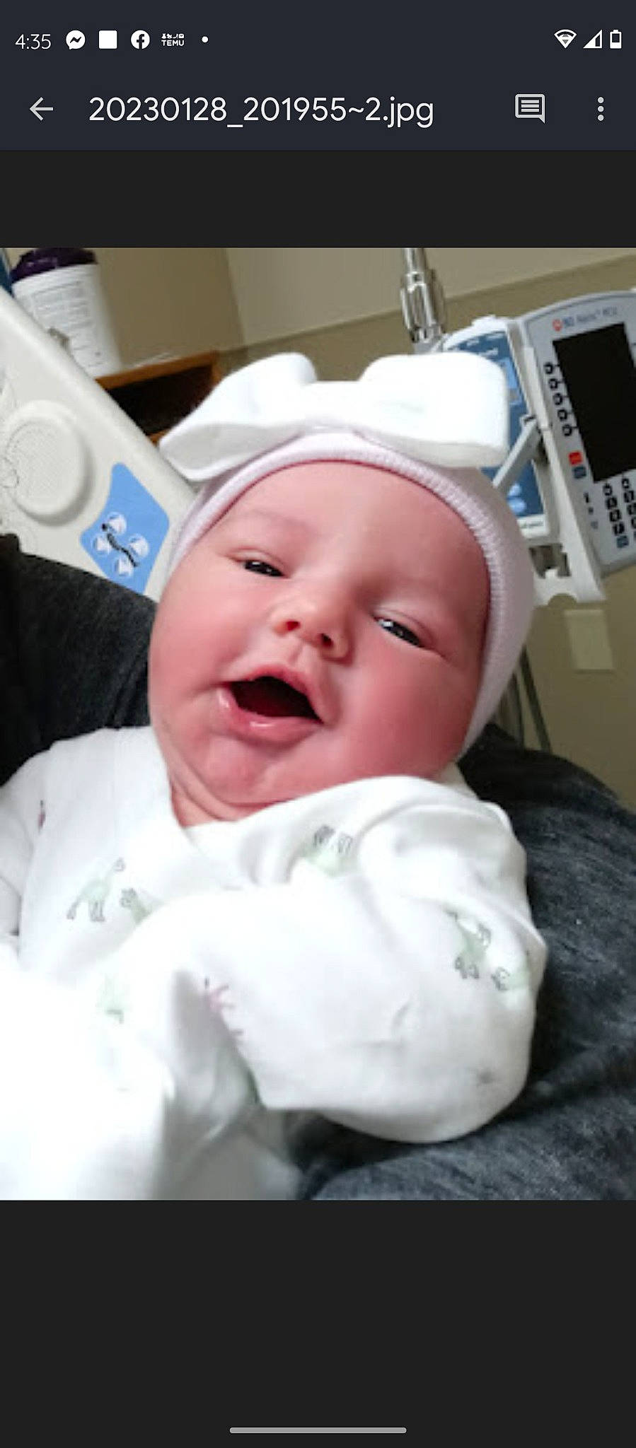 Karma is registered to the contest to win money with this photo: baby, baby_toddler_clothing, cheek, child, comfort, event, eye, eyebrow, fun, happy, hat, head, headwear, laugh, linens, nose, paper_towel, person, room, service