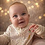 Everly is registered to the contest to win money with this photo: baby, smiling, face, onesie, infant, cute, happy, portrait, child, indoor, bokeh, background, soft_lighting, close_up, hand, eyes, skin, expression, cozy, warm