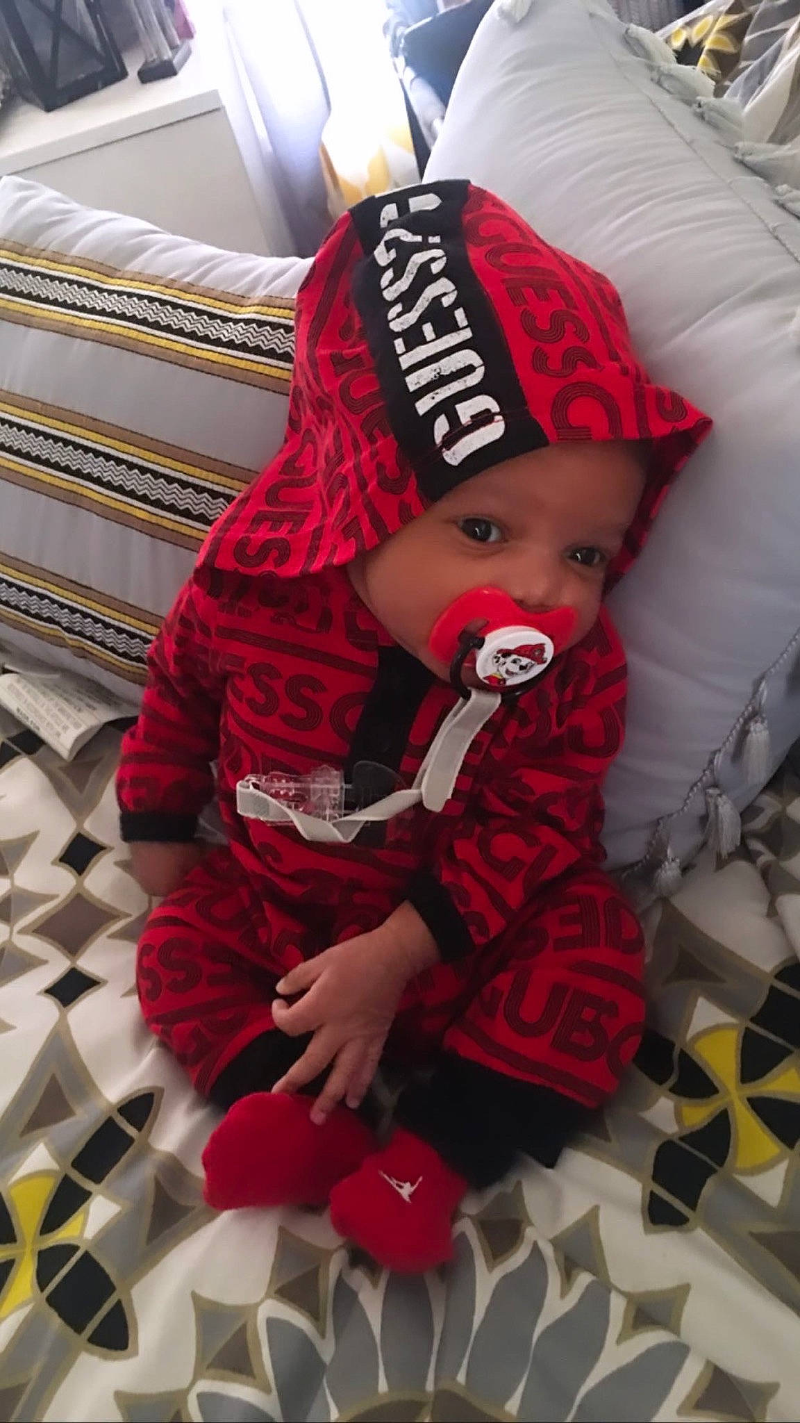 Asiah joined the competition — help win amazing prizes! baby, beanie, cap, child, costume, fictional_character, headgear, headwear, outerwear, person, red, toddler