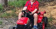 Benjamin Cash joined the competition — help win amazing prizes! blue_shoes, boy, casual_clothing, child, dirt, grass, gravel_path, happy, nature, outdoor, play, red_shirt, shorts, smile, spiderman, summer, toy_tractor, vehicle, wooden_post, young