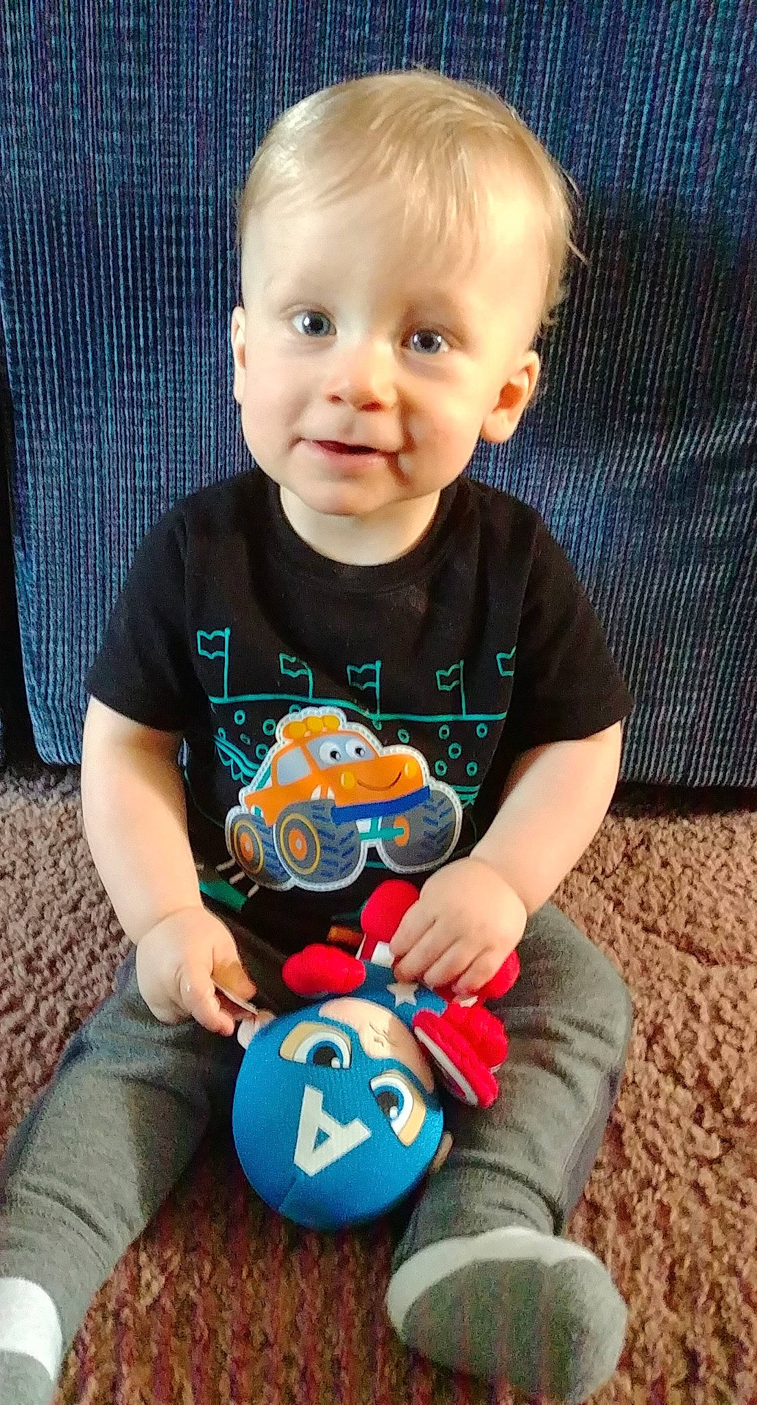 Conner joined the competition — help win amazing prizes! baby, baby_products, baby_toddler_clothing, baby_toys, ball, cheek, child, person, play, product, sitting, sleeve, soccer_ball, t_shirt, toddler, toy