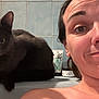 Yoshi participe au concours pour gagner de l'argent avec cette photo : person, cat, bathroom, selfie, gray_cat, tiles, bathtub, toiletries, smiling, face, fur, indoor, portrait, curious, closeup, wall, head, skin, expression, relaxed
