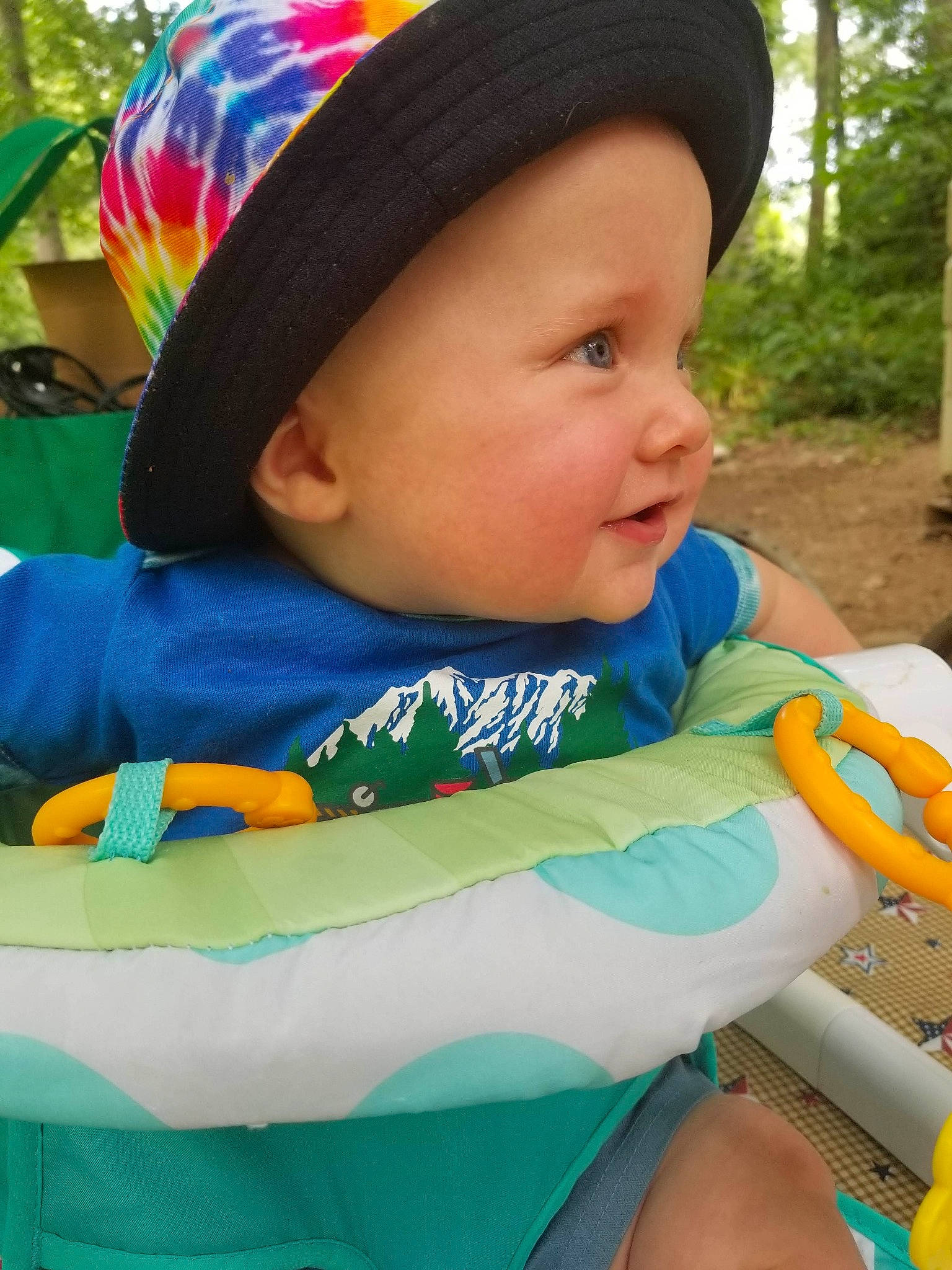 Koby is registered to the contest to win money with this photo: baby, baby_carriage, baby_products, baby_toddler_clothing, cap, face, fun, grass, happy, hat, headwear, leisure, person, personal_protective_equipment, plant, recreation, sitting, skin, smile, sun_hat