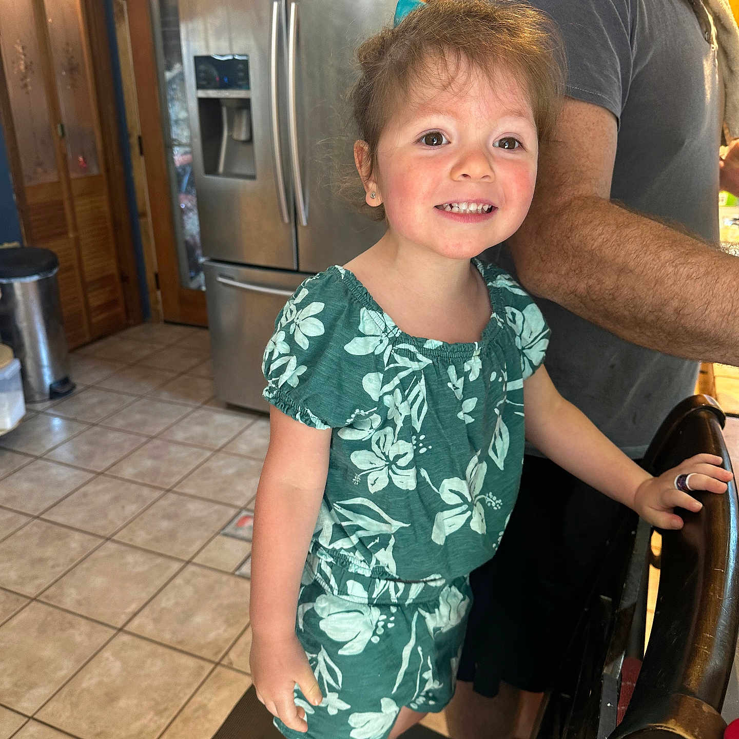 Kaya is registered to the contest to win money with this photo: appliance, clothing, couch, device, diningtable, dress, electricaldevice, face, furniture, head, indoors, pants, person, photography, portrait, refrigerator, shorts, t_shirt, table, wood