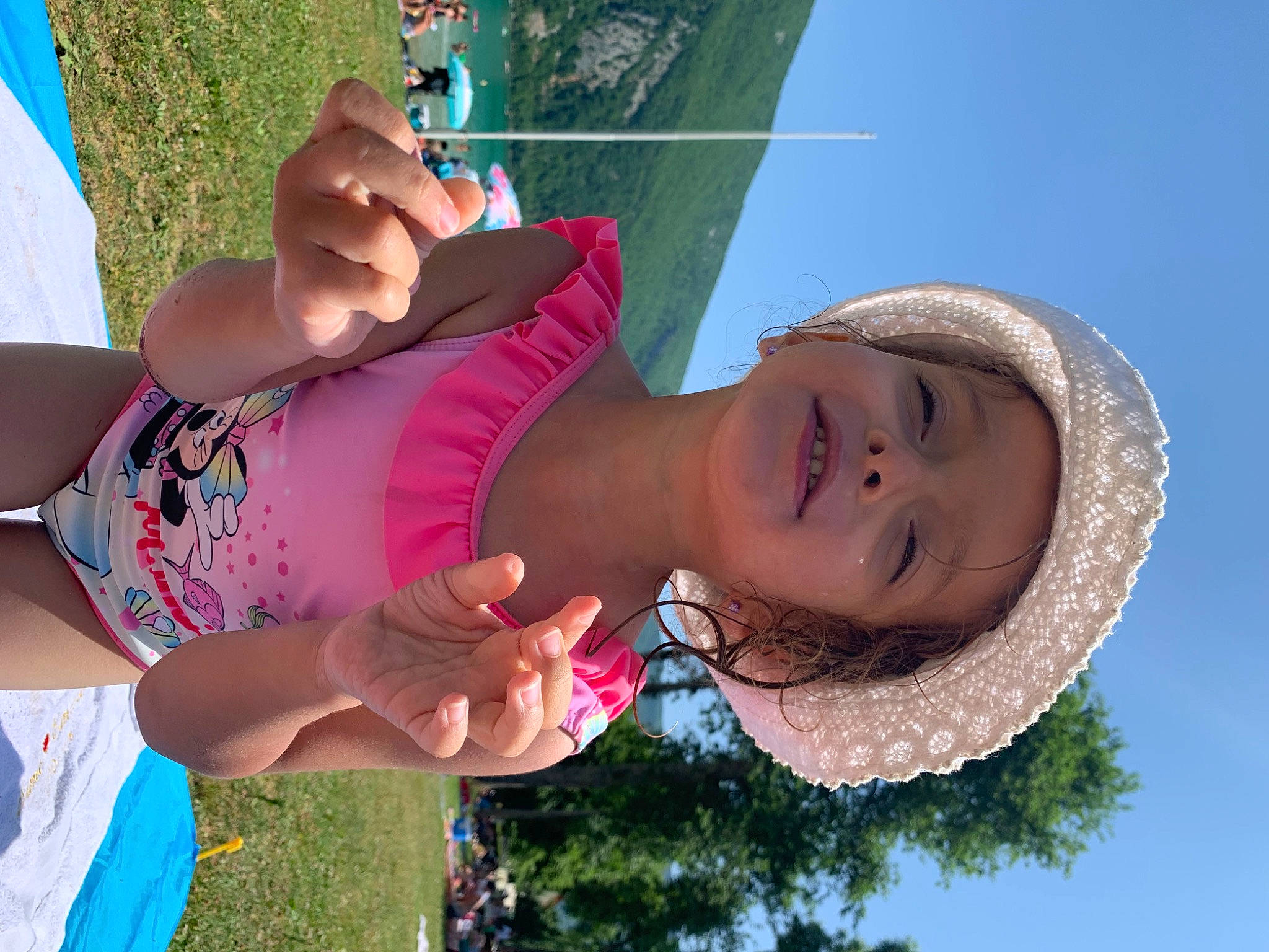 Elena participe au concours pour gagner de l'argent avec cette photo : blue, child, facial_expression, fun, grass, green, happy, hat, headwear, joy, leisure, mouth, nature, people, people_in_nature, person, photograph, skin, sky, smile
