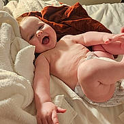 Charlotte is registered to the contest to win money with this photo: baby, infant, smiling, happy, bed, blanket, diaper, skin, arm, leg, hand, foot, indoors, soft, cozy, child, person, expression, cute, playful