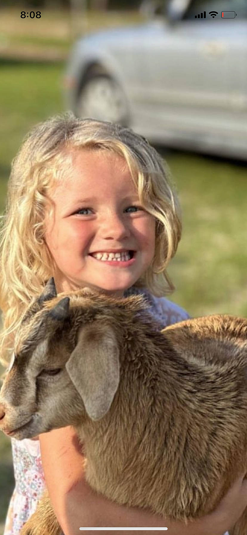 Jazmine is registered to the contest to win money with this photo: ear, event, eye, facial_expression, fawn, grass, hair, happy, head, joy, liver, livestock, long_hair, mammal, nose, people_in_nature, person, skin, smile, terrestrial_animal
