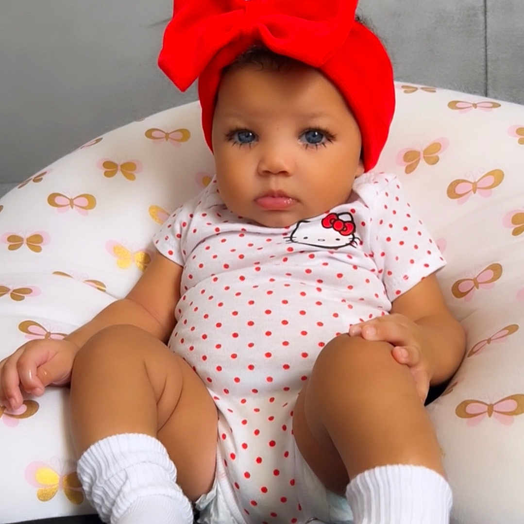Dynver joined the competition — help win amazing prizes! baby, bodypart, bonnet, cap, clothing, couch, face, finger, footwear, furniture, hand, hat, head, hosiery, person, photography, portrait, shoe, sitting, sock
