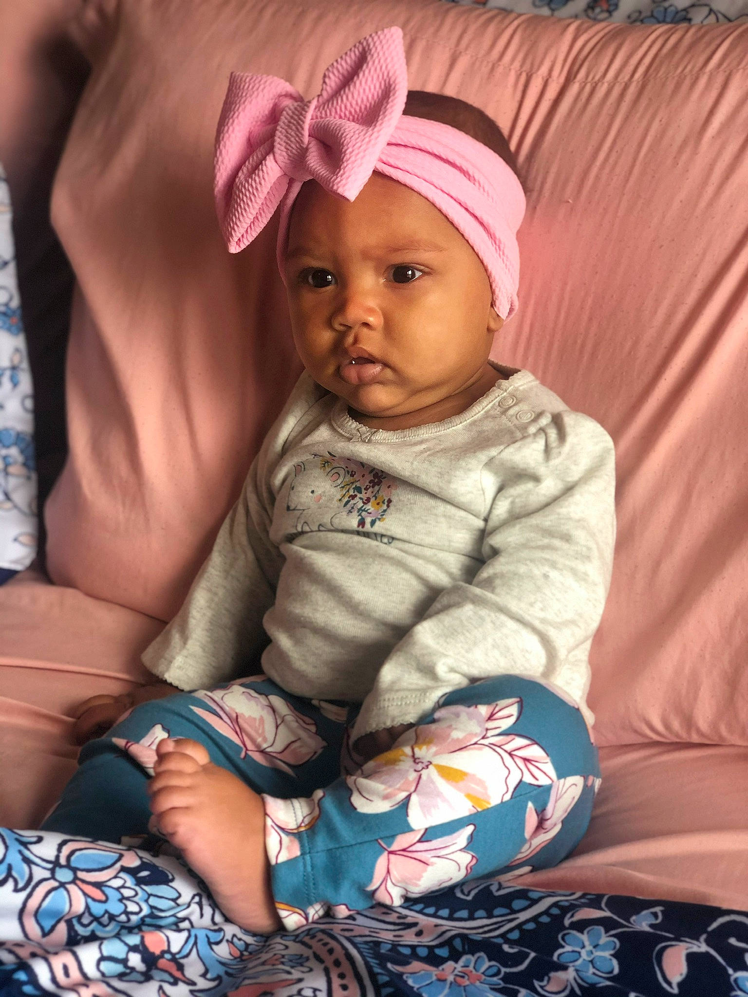 Dalilah joined the competition — help win amazing prizes! baby, baby_toddler_clothing, cheek, child, headgear, headwear, person, pink, sitting, skin, smile, toddler